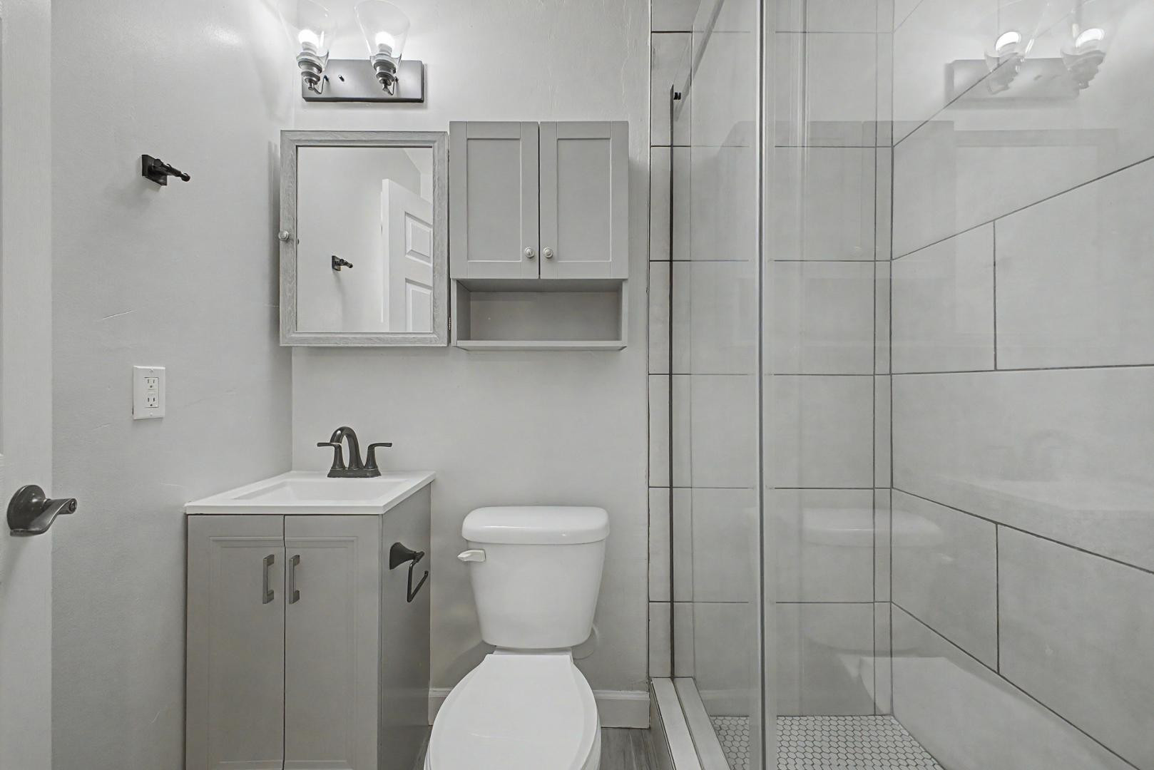 2534 North 28th Street Phoenix, AZ 85008 - Photo 16 of 33 a bathroom with a toilet sink and shower
