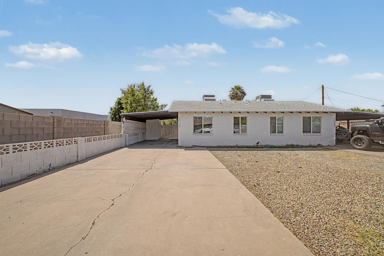 2534 North 28th Street Phoenix, AZ 85008 - Photo 5 of 33 a front view of a house with a yard and garage