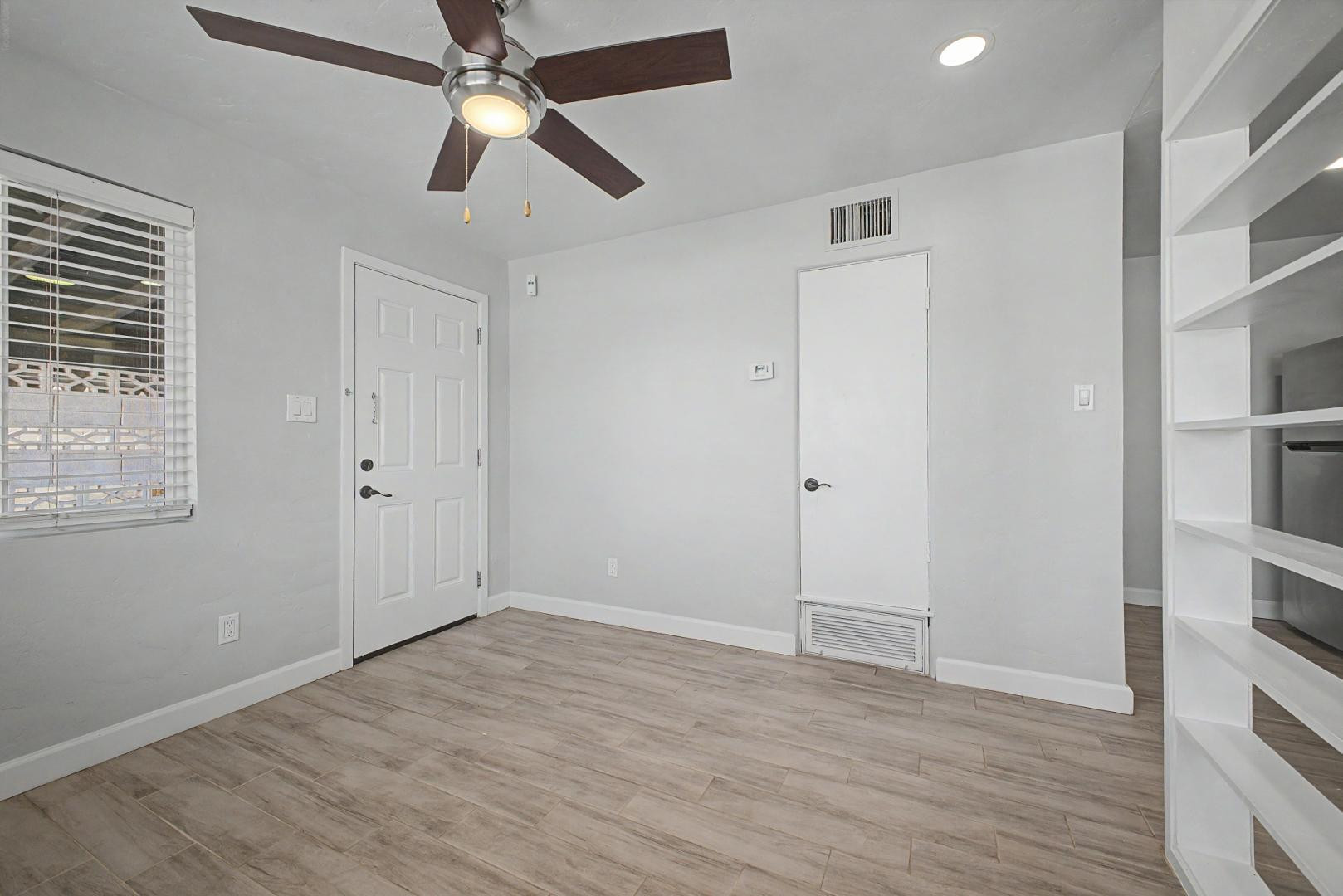 2534 North 28th Street Phoenix, AZ 85008 - Photo 9 of 33 an empty room with closet and a ceiling fan