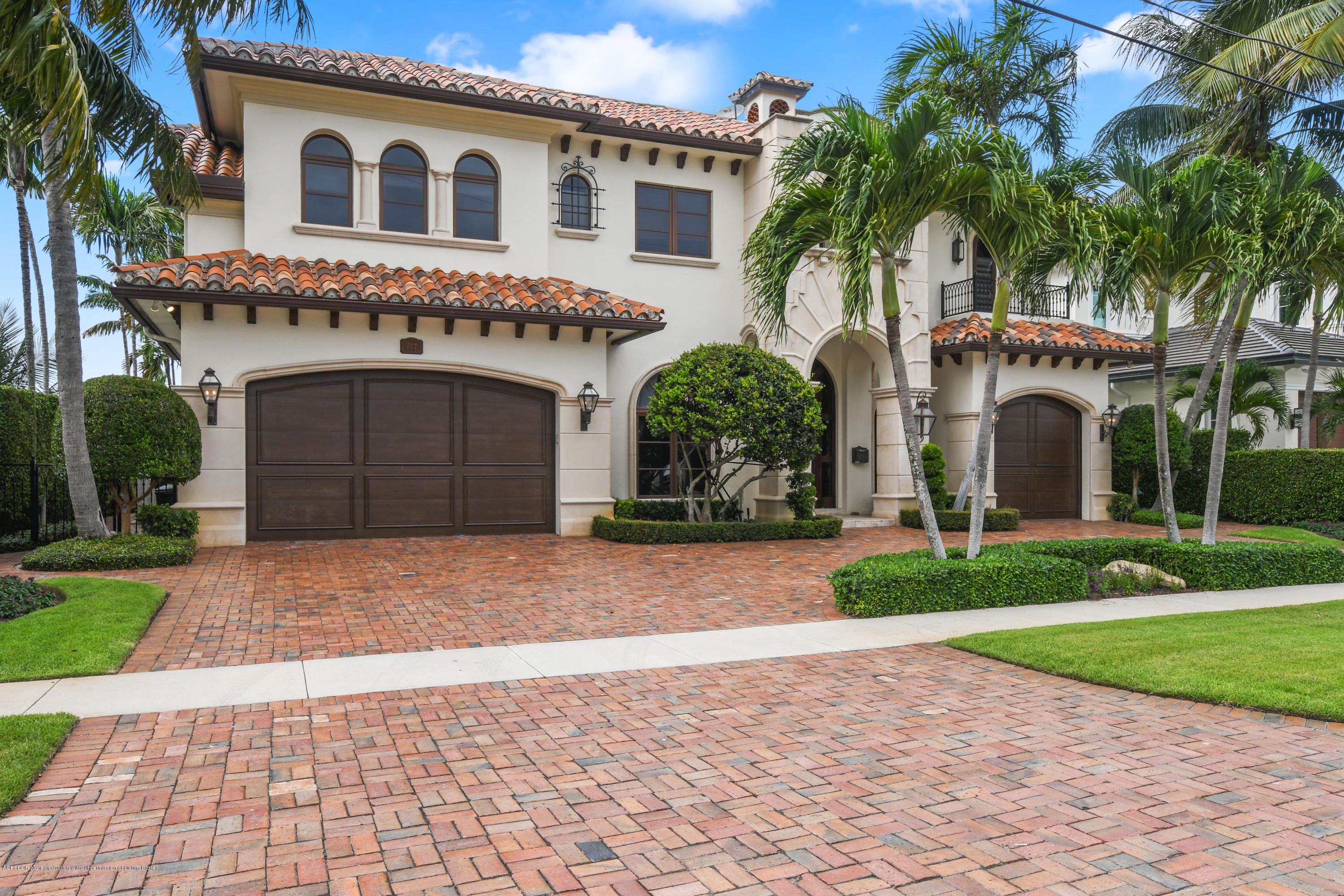 777 Northeast 35th Street Boca Raton, FL 33431 - Photo 1 of 50 a front view of a house with a yard and garage