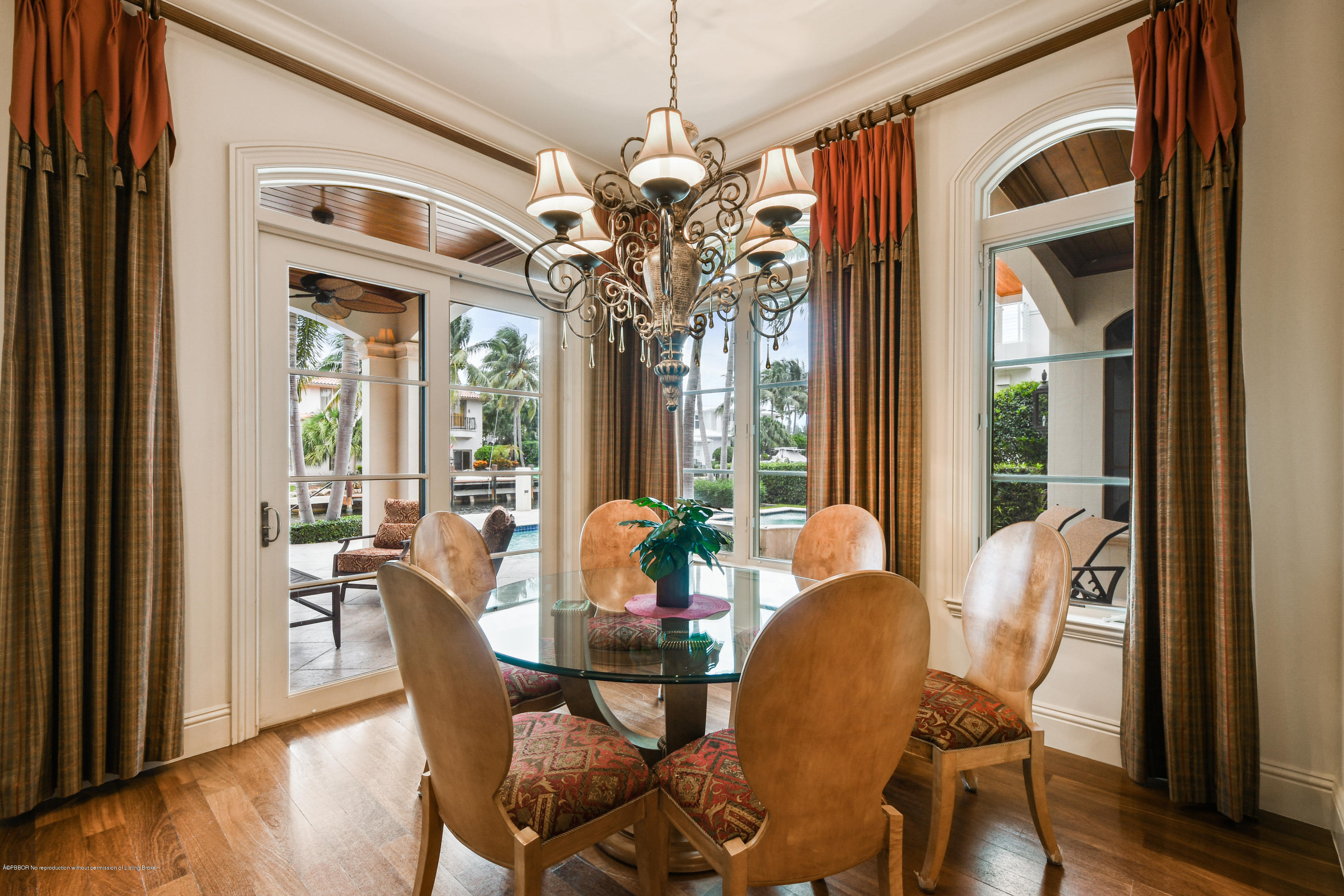 777 Northeast 35th Street Boca Raton, FL 33431 - Photo 18 of 50 a dining room with furniture a chandelier and wooden floor