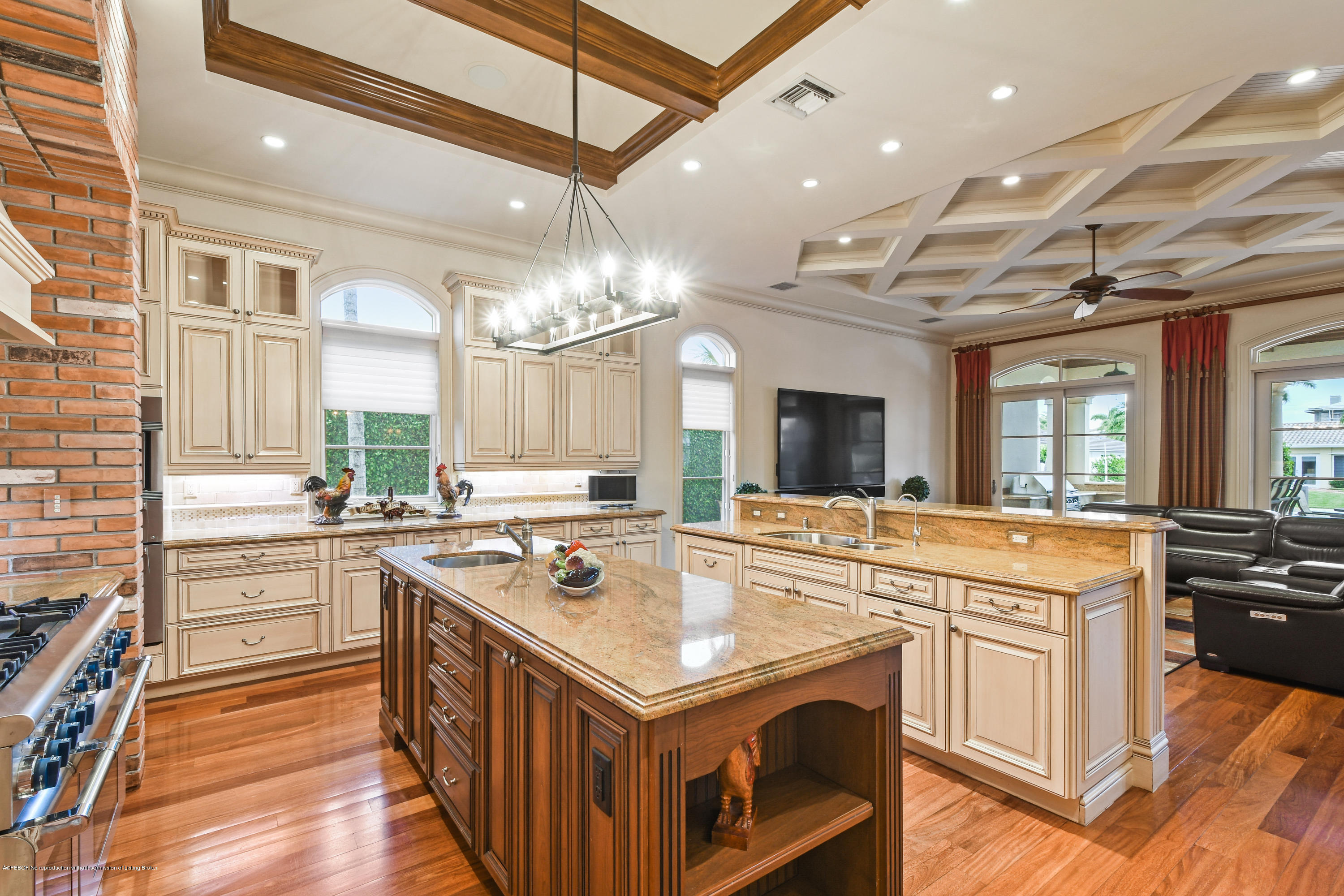 777 Northeast 35th Street Boca Raton, FL 33431 - Photo 21 of 50 a kitchen with a stove sink and a refrigerator