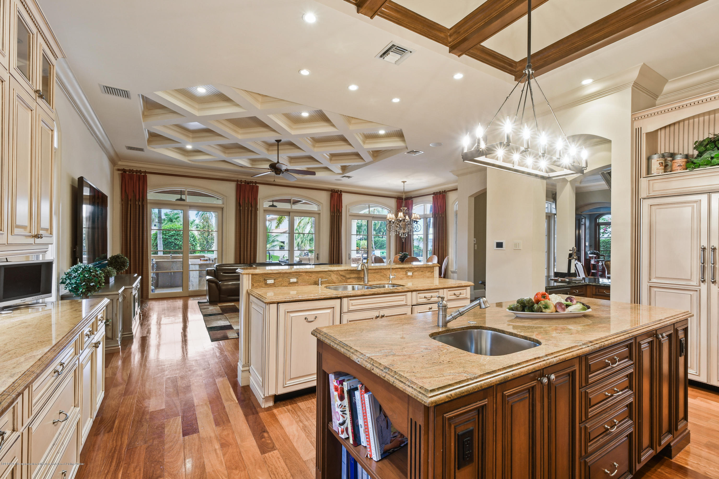 777 Northeast 35th Street Boca Raton, FL 33431 - Photo 22 of 50 a kitchen with sink stove and large windows