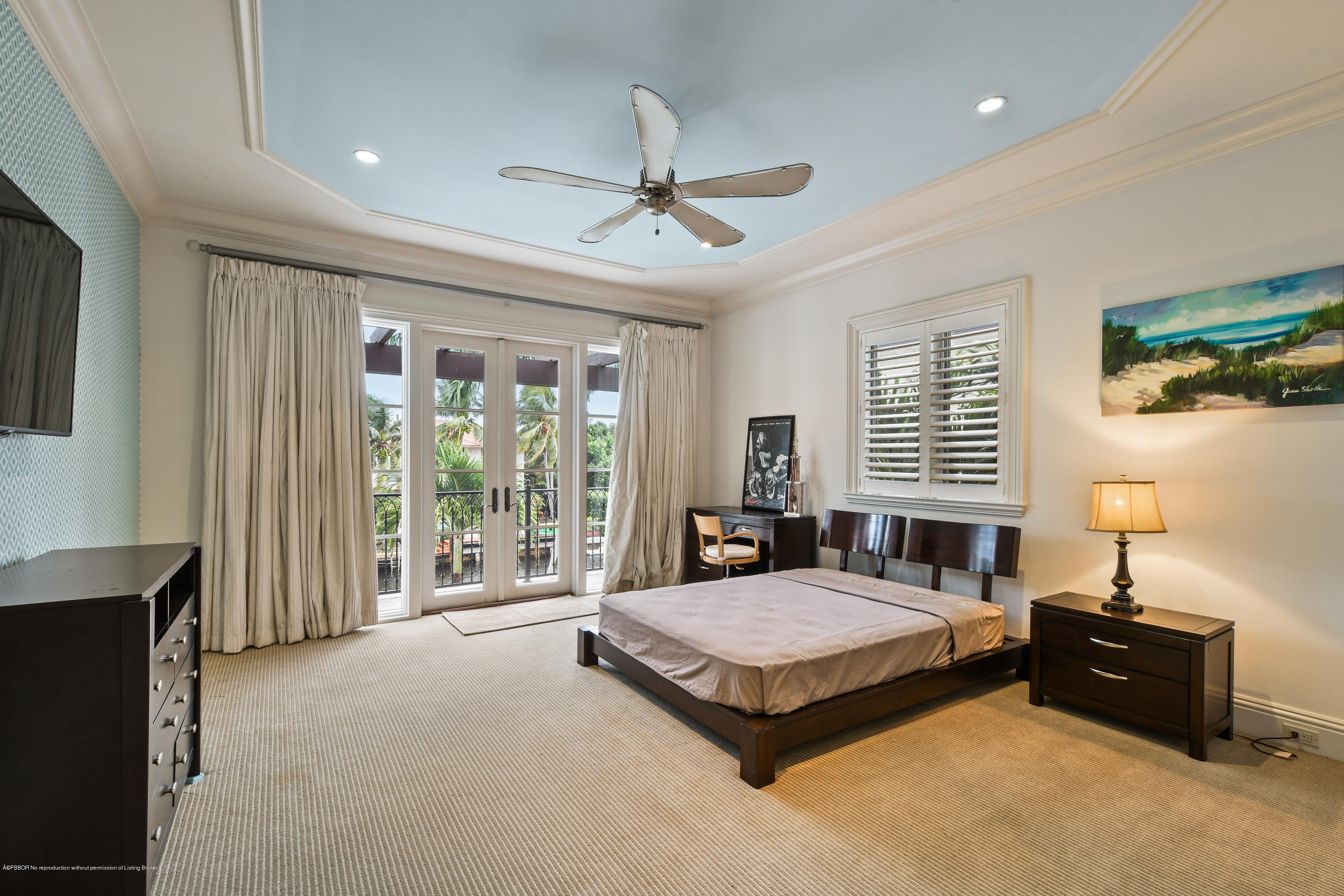 777 Northeast 35th Street Boca Raton, FL 33431 - Photo 36 of 50 a spacious bedroom with a bed and large windows