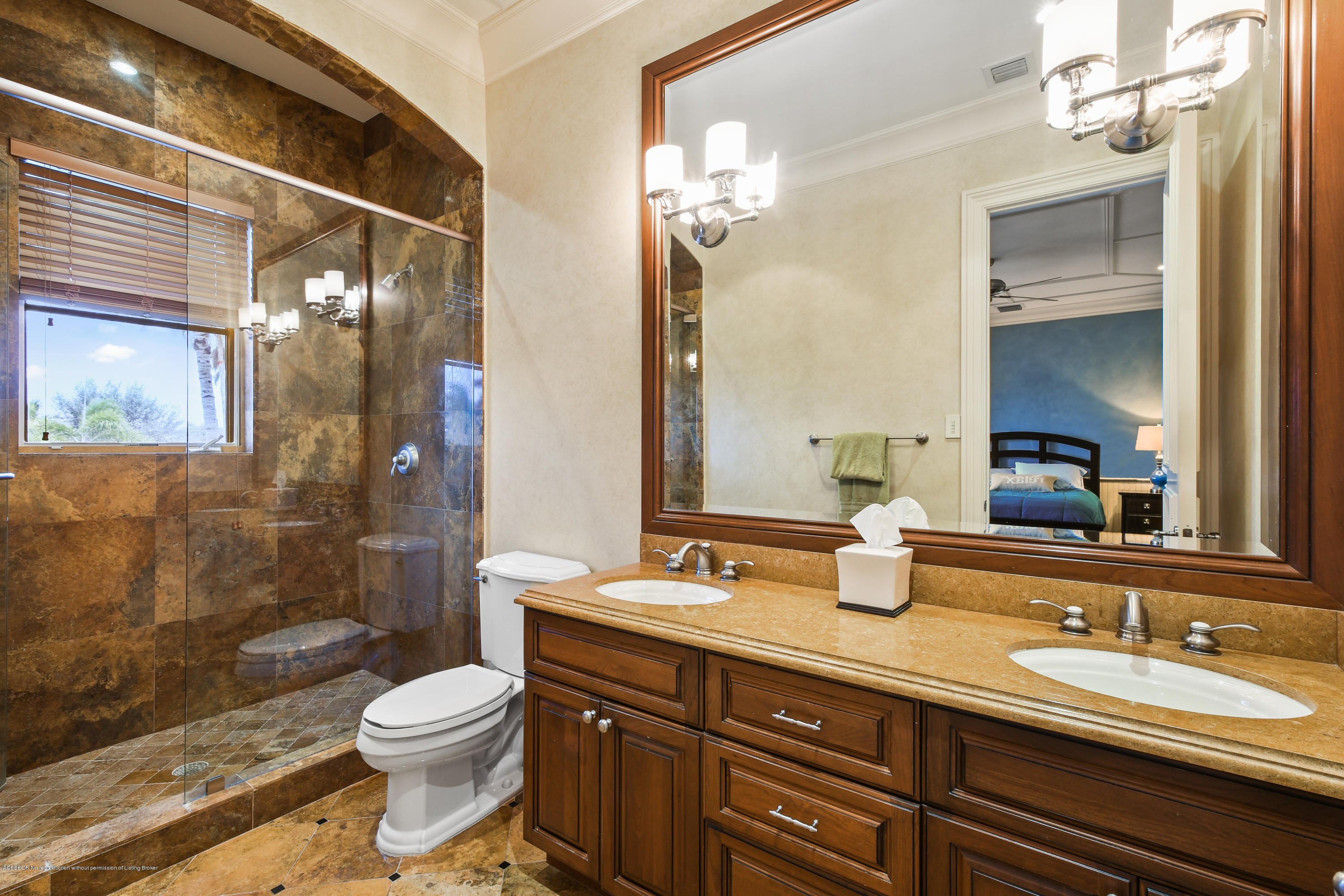 777 Northeast 35th Street Boca Raton, FL 33431 - Photo 40 of 50 a bathroom with a granite countertop sink toilet a mirror and shower