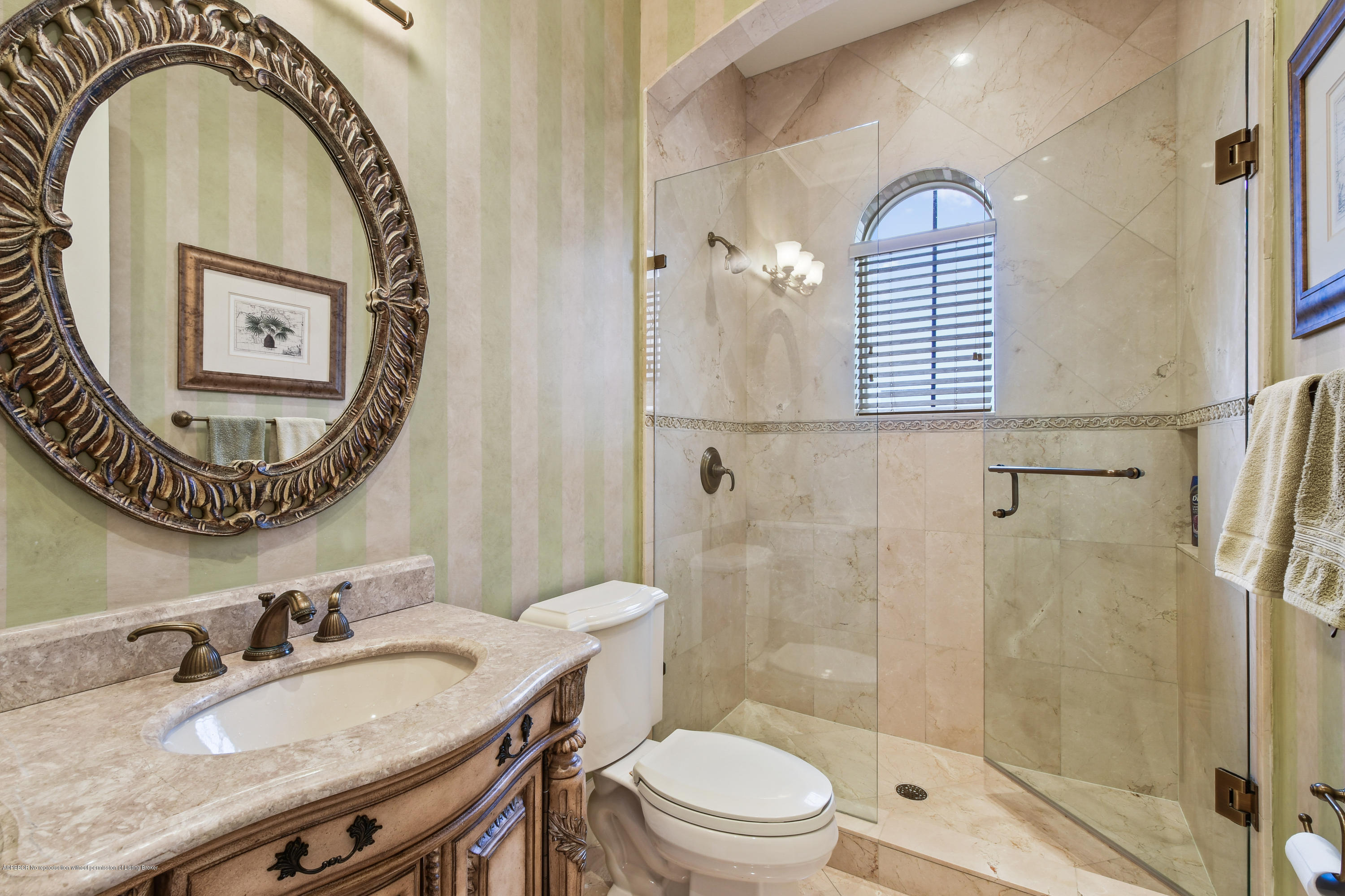 777 Northeast 35th Street Boca Raton, FL 33431 - Photo 42 of 50 a bathroom with a sink a mirror a toilet and a shower