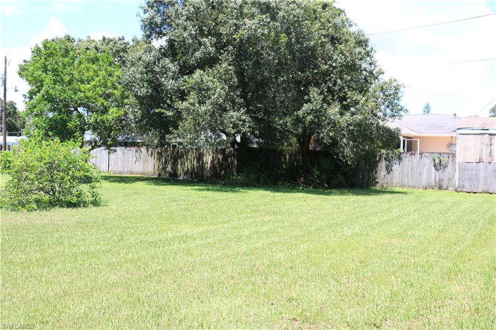 19177 Acorn Road Fort Myers, FL 33967 - Photo 8 of 24 a backyard of a house with lots of green space