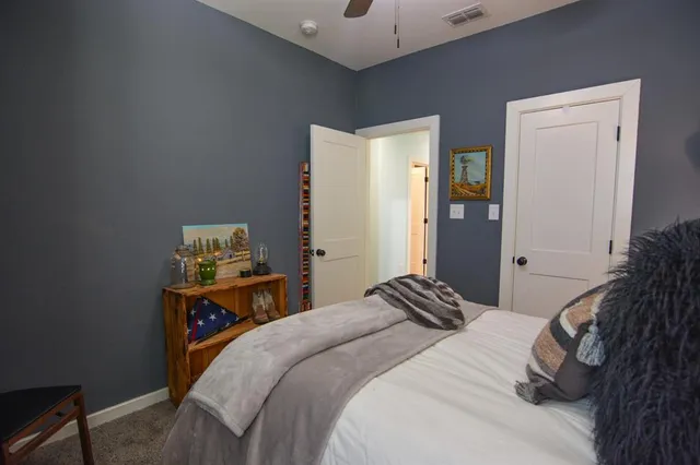 a bedroom with a bed and a cabinets