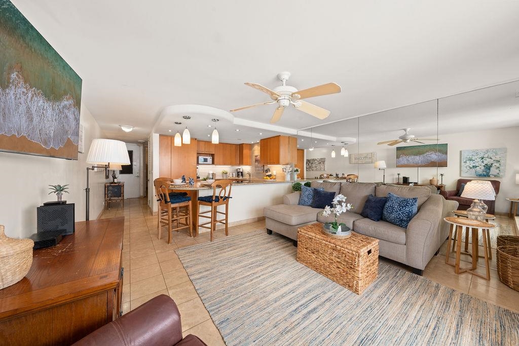 3785 Lower Honoapiilani Road, Unit 208 Lahaina, HI 96761 - Photo 20 of 50 a living room with furniture kitchen view and a wooden floor