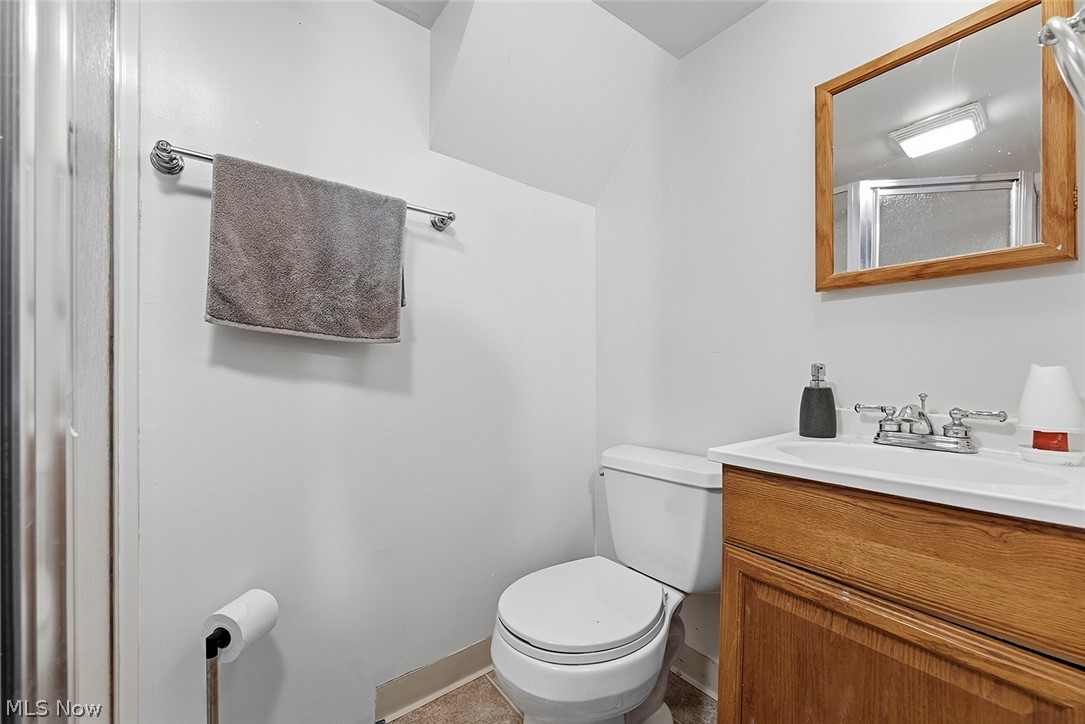 5615 Snow Road Parma, OH 44129 - Photo 27 of 39 Full bathroom with vanity and a shower with door