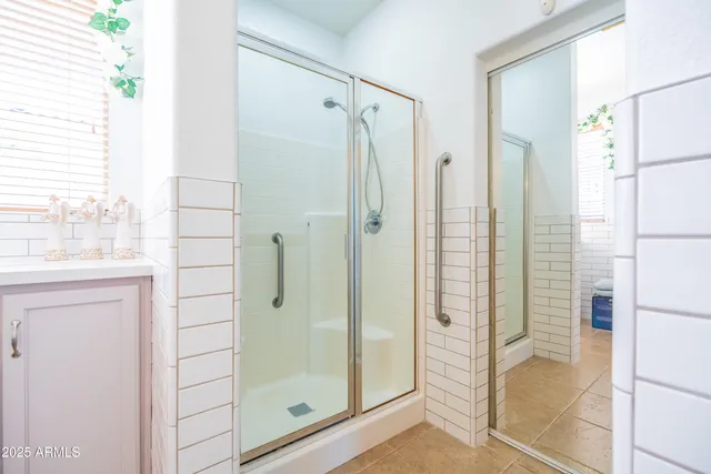 a bathroom with a shower and a sink