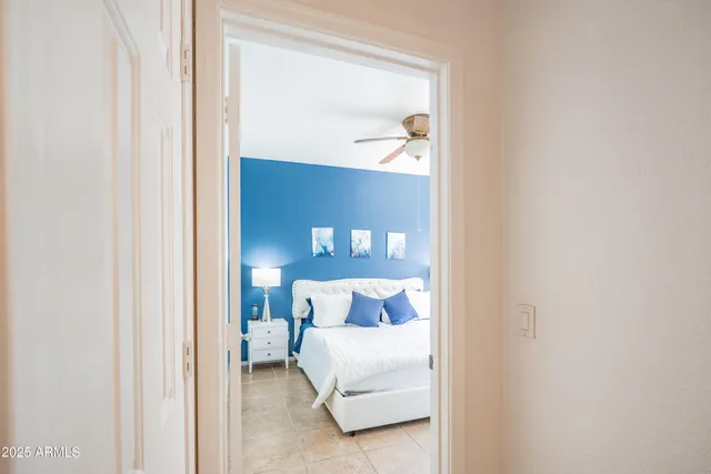 a bedroom with a bed and a mirror