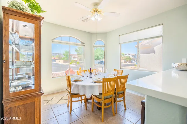 a dining room with furniture and window