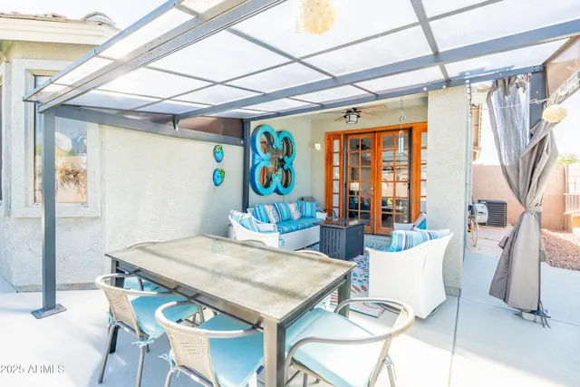 a view of a dining room with furniture window and outside view
