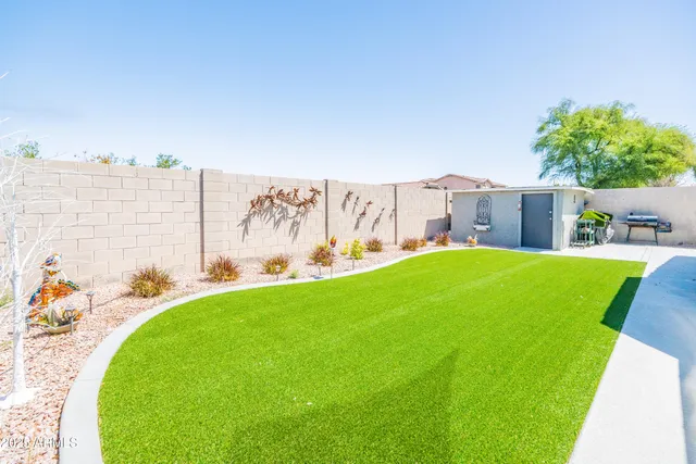 a view of yard with swimming pool outdoor seating