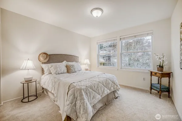 a bedroom with a bed and a table