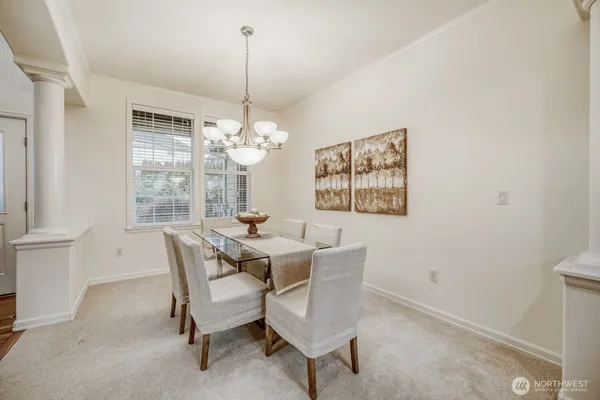 a view of a dining room with furniture window and outside view