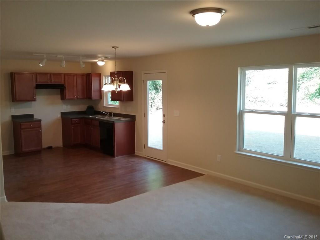 2036 Gunnars Ridge Road, Unit 28 Lancaster, SC 29720 - Photo 8 of 9 an empty room with kitchen appliances and windows