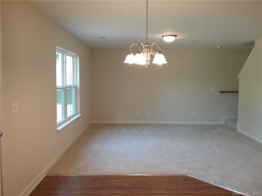 2036 Gunnars Ridge Road, Unit 28 Lancaster, SC 29720 - Photo 9 of 9 a view of a windows and a chandelier in a room