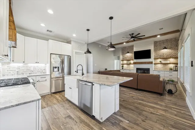 an aerial view of a residential houses with outdoor space