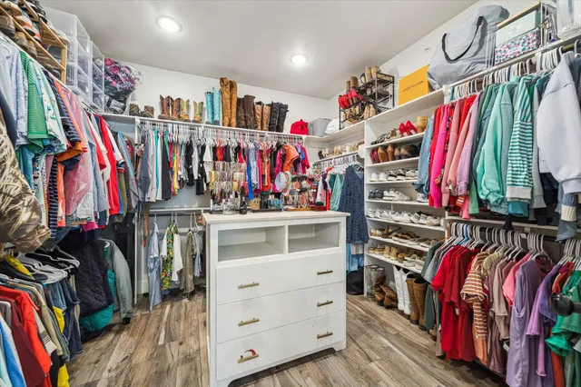 a bathroom with a double vanity sink a mirror and shower