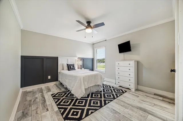 a view of a hallway with the wooden floor and staircase