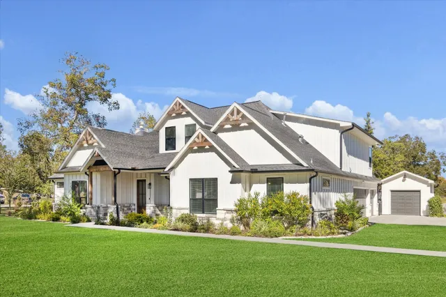 front view of a house with a yard