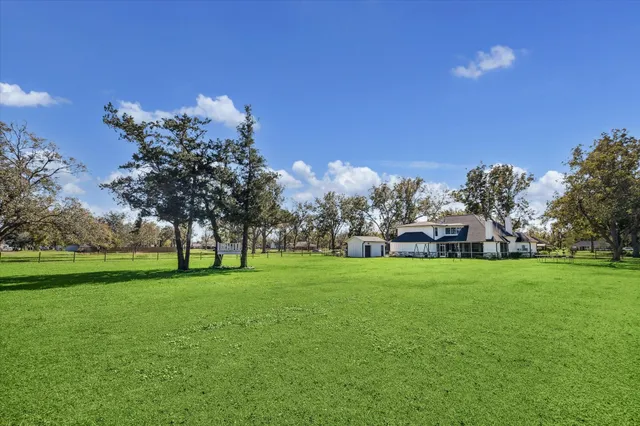a view of a livingroom with furniture and a window