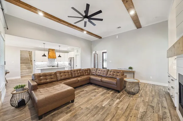 an aerial view of a house with swimming pool garden and patio