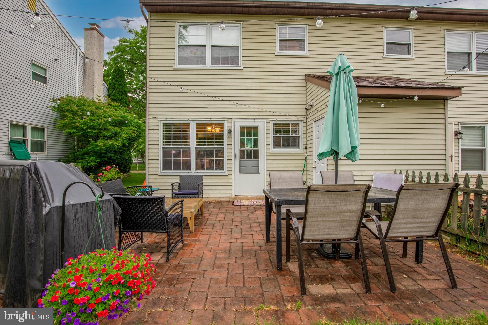 Exterior rear with paved patio.