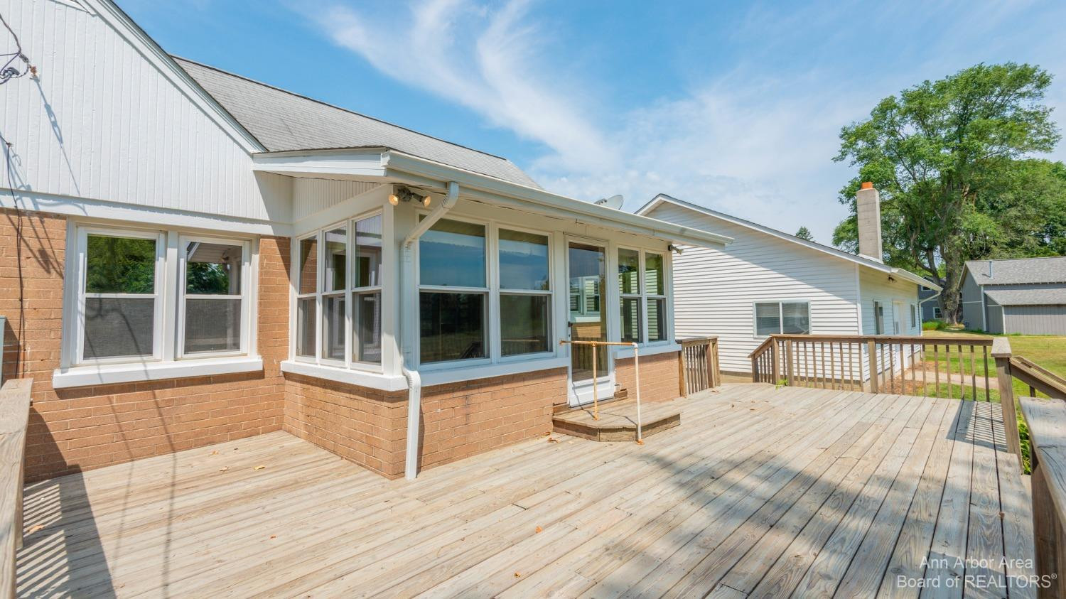 6900 Dexter-Pinckney Road Dexter, MI 48130 - Photo 24 of 30 Deck off Enclosed 3 Season Porch