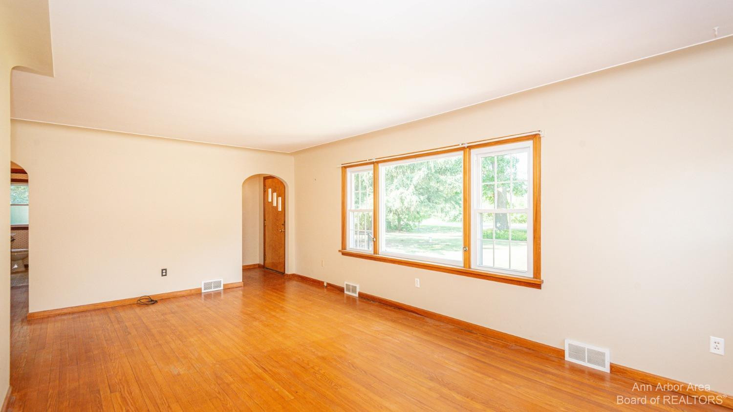 6900 Dexter-Pinckney Road Dexter, MI 48130 - Photo 4 of 30 Spacious Living Room with Coved Ceiling