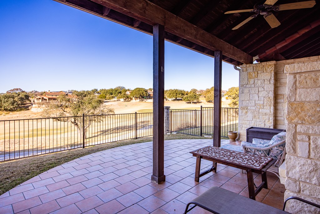 3801-12 Club House Road Kerrville, TX 78028 - Photo 17 of 23 a view of a balcony with chair and table