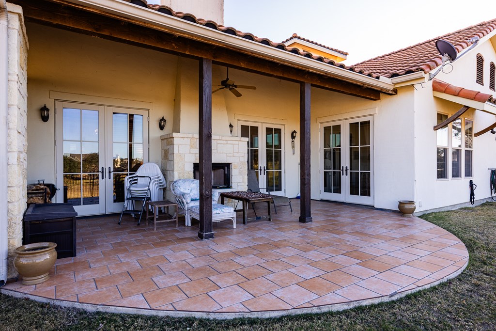 3801-12 Club House Road Kerrville, TX 78028 - Photo 18 of 23 a view of a house with backyard porch and sitting area