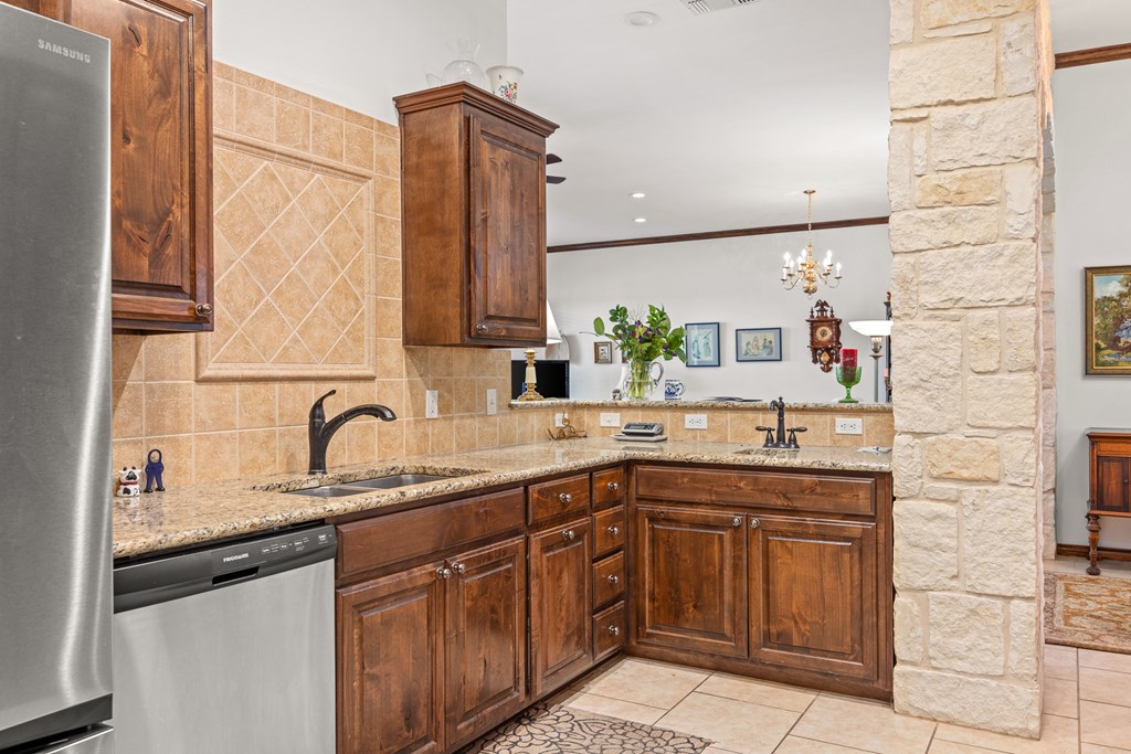 3801-12 Club House Road Kerrville, TX 78028 - Photo 8 of 23 a kitchen with a sink and cabinets
