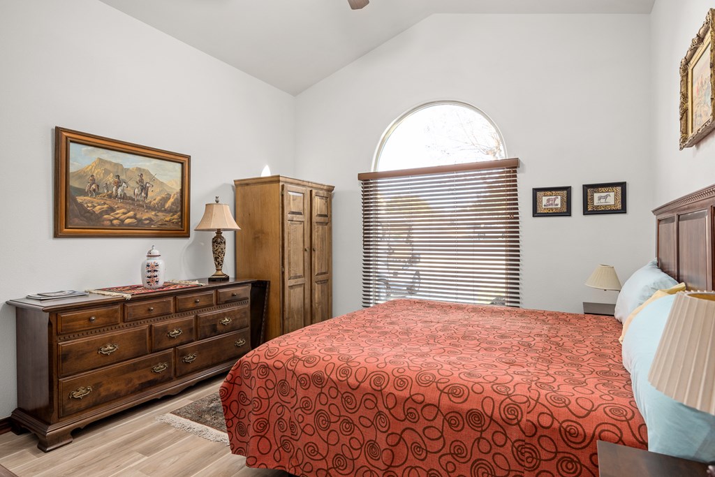 3801-12 Club House Road Kerrville, TX 78028 - Photo 10 of 23 a bedroom with a bed and a flat tv screen on dresser