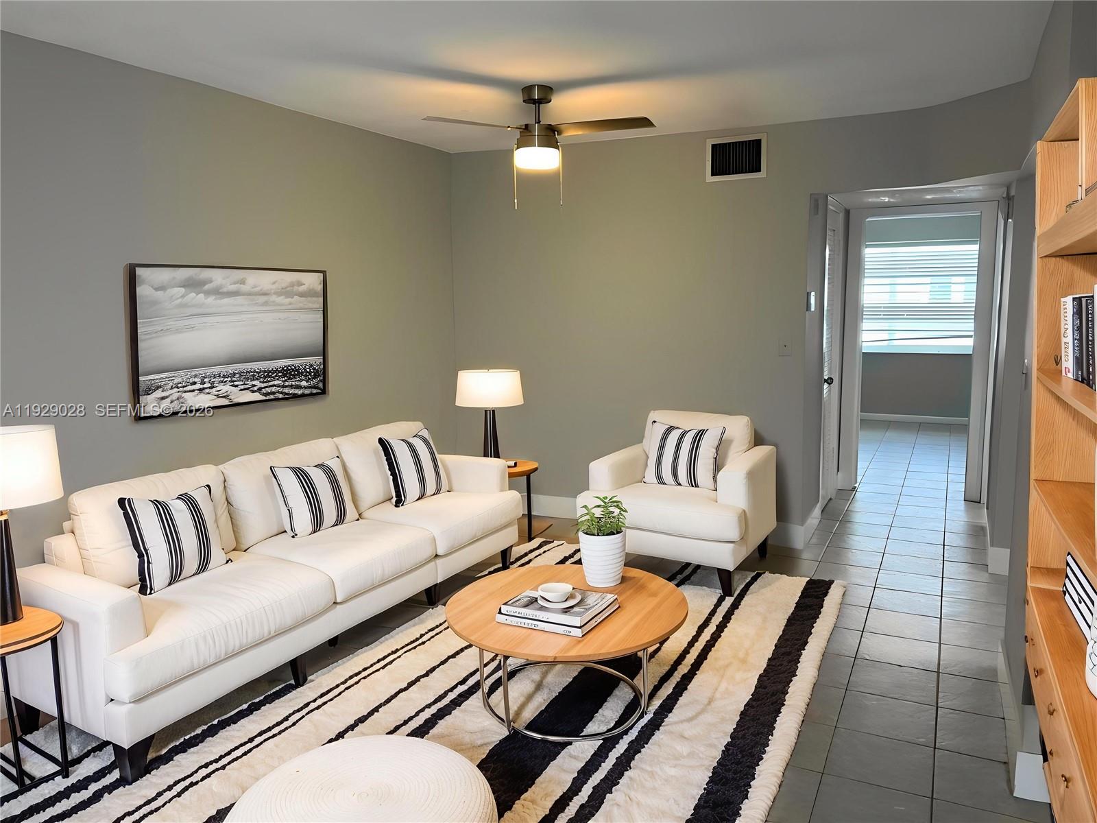 a living room with furniture and a table
