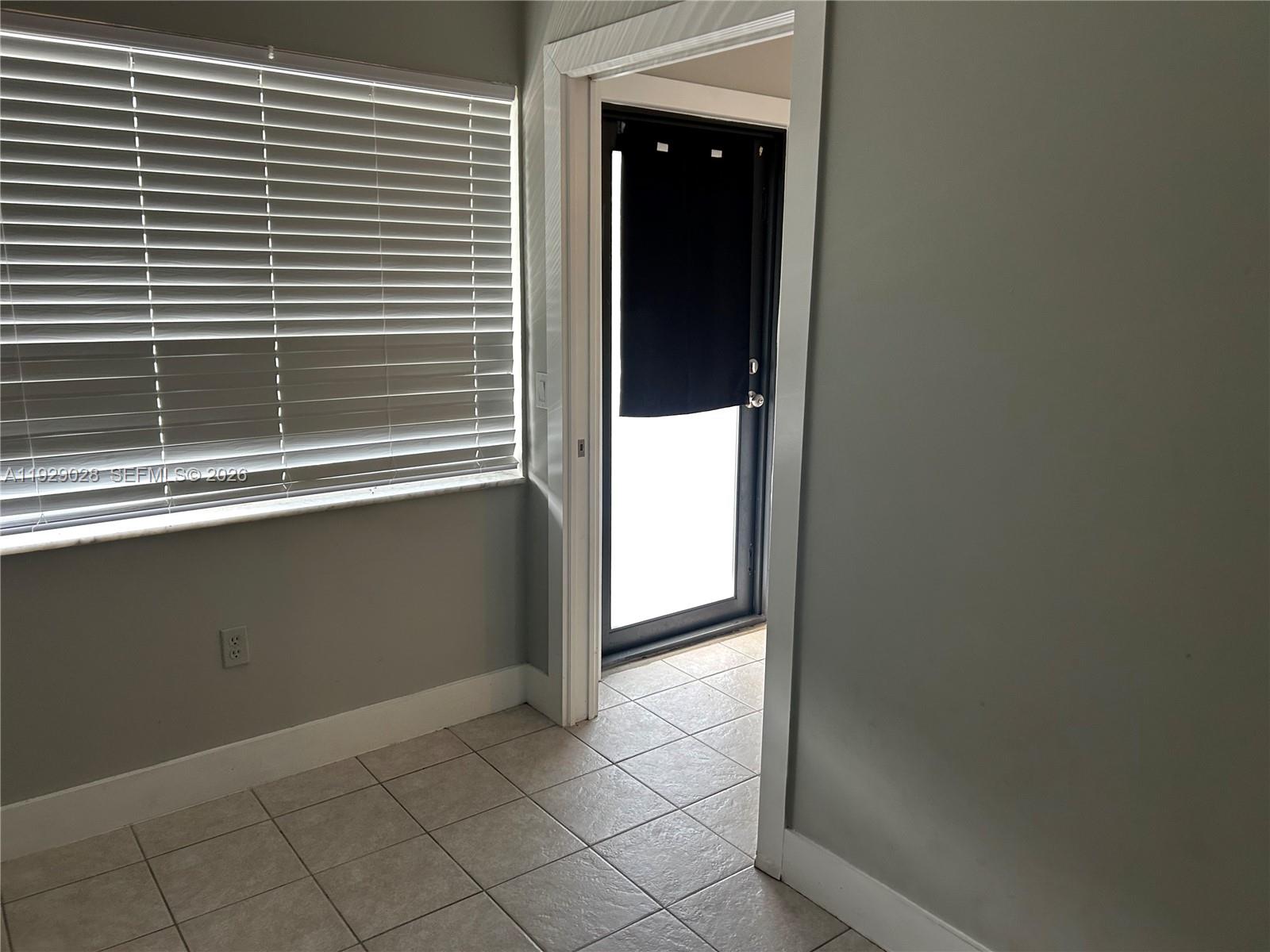 335 Southwest 20th Street, Unit 7 Fort Lauderdale, FL 33315 - Photo 13 of 17 a view of a room that has a window in it