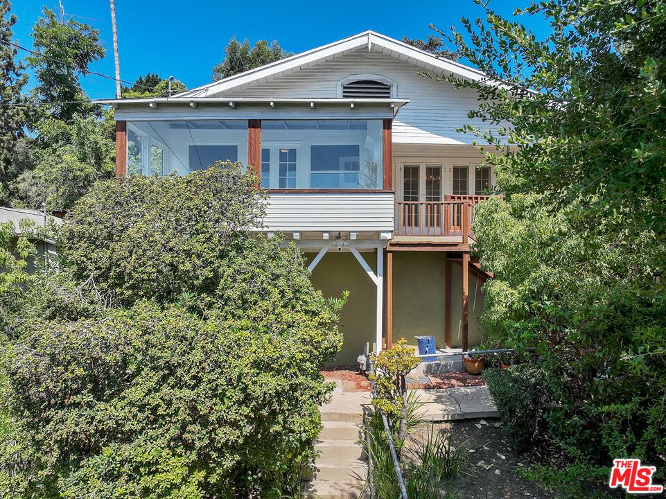 2117 Vestal Avenue Los Angeles, CA 90026 - Photo 1 of 26 a front view of a house with garden