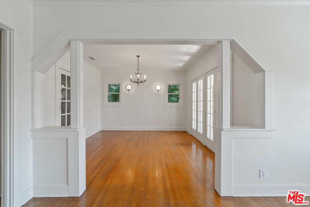 2117 Vestal Avenue Los Angeles, CA 90026 - Photo 11 of 26 wooden floor in an empty room with a window