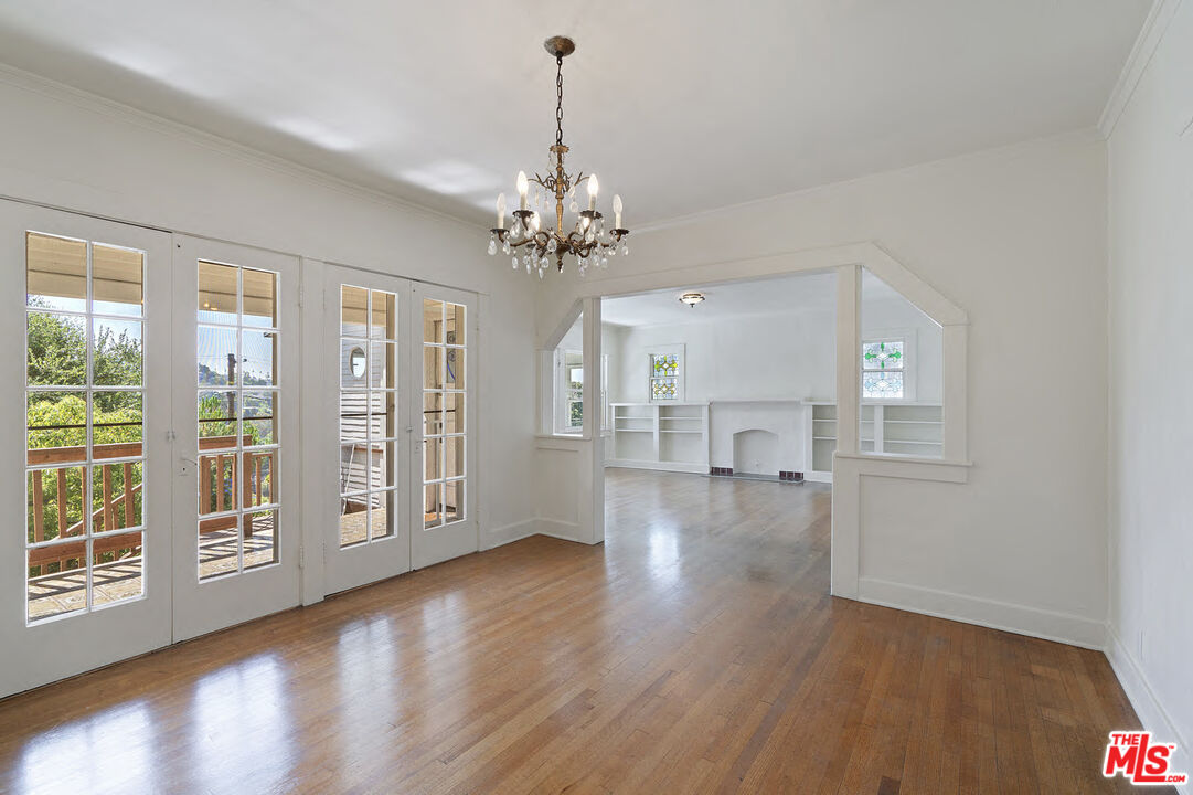2117 Vestal Avenue Los Angeles, CA 90026 - Photo 12 of 26 a view of an empty room with wooden floor and a window