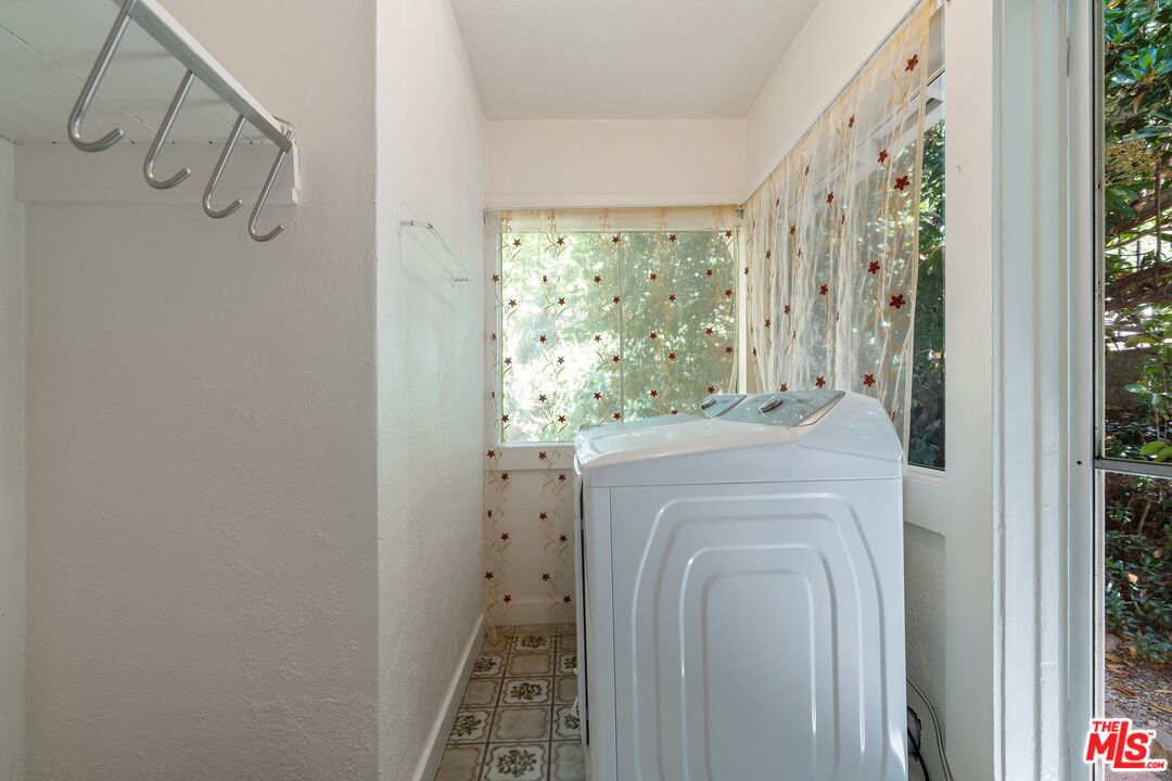 2117 Vestal Avenue Los Angeles, CA 90026 - Photo 16 of 26 a bathroom with a shower a sink and a mirror