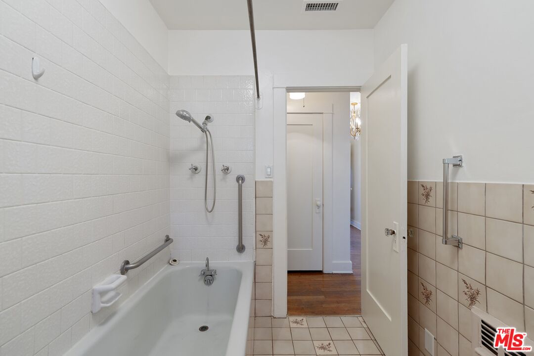 2117 Vestal Avenue Los Angeles, CA 90026 - Photo 20 of 26 a bathroom with a bathtub and a shower