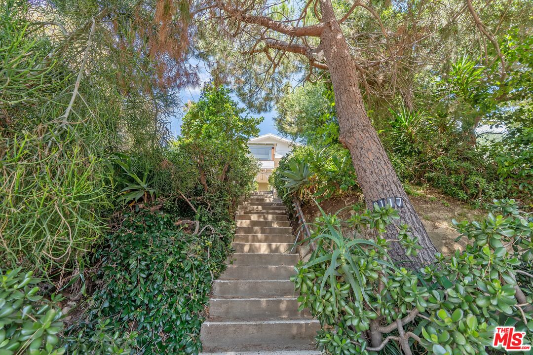 2117 Vestal Avenue Los Angeles, CA 90026 - Photo 2 of 26 a view of a pathway both side of yard
