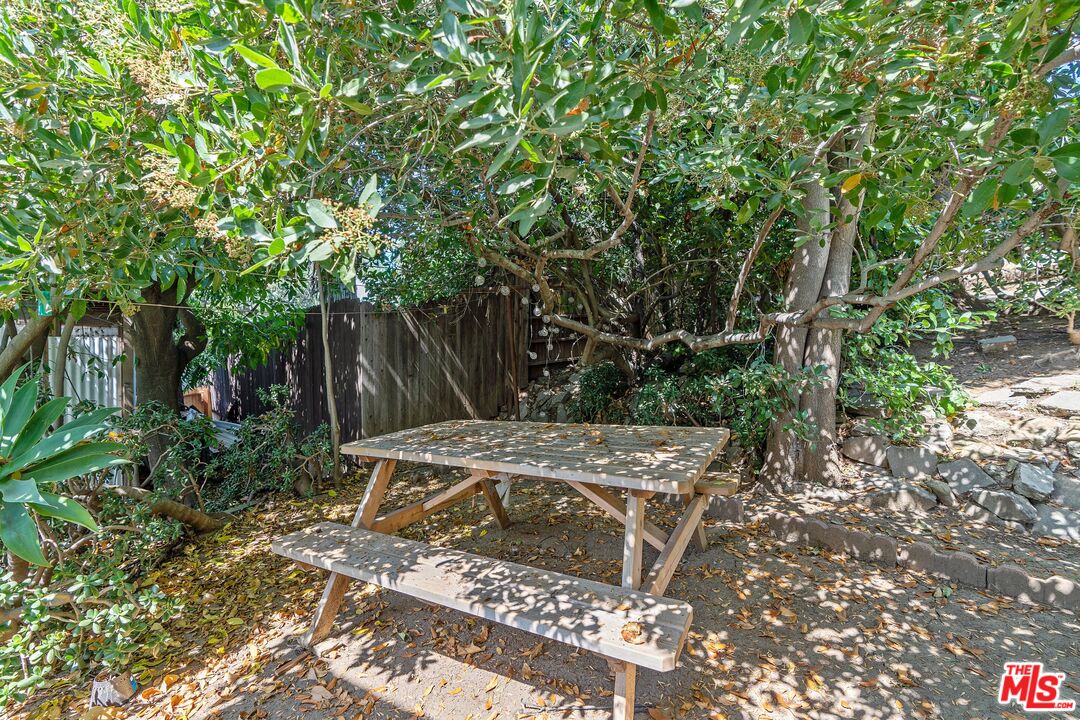 2117 Vestal Avenue Los Angeles, CA 90026 - Photo 24 of 26 a view of backyard with wooden fence and a large tree