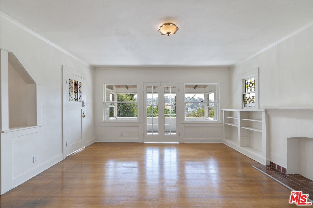 2117 Vestal Avenue Los Angeles, CA 90026 - Photo 8 of 26 wooden floor in an empty room with a window
