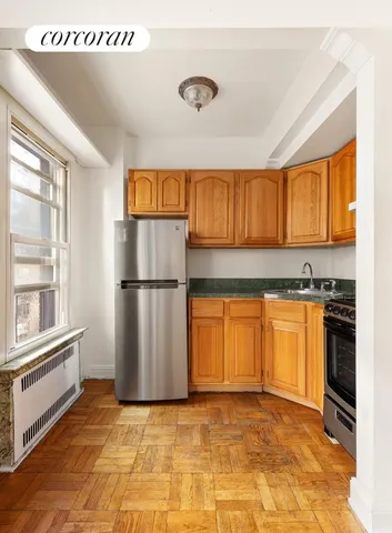 a living room with furniture a large window and a flat screen tv