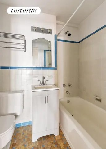 a view of kitchen with stainless steel appliances granite countertop a stove top oven a refrigerator a sink and dishwasher with wooden floor