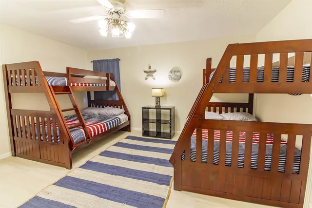 a bedroom with furniture and a window