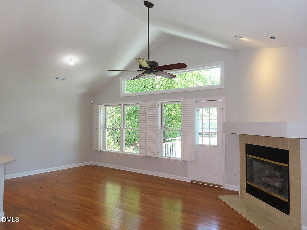 120 Weatherhill Point Carrboro, NC 27510 - Photo 3 of 25 a view of an empty room with a window and wooden floor